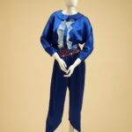 Jumpsuit made of satin with a hand-embellished belt featuring sparkling stones.